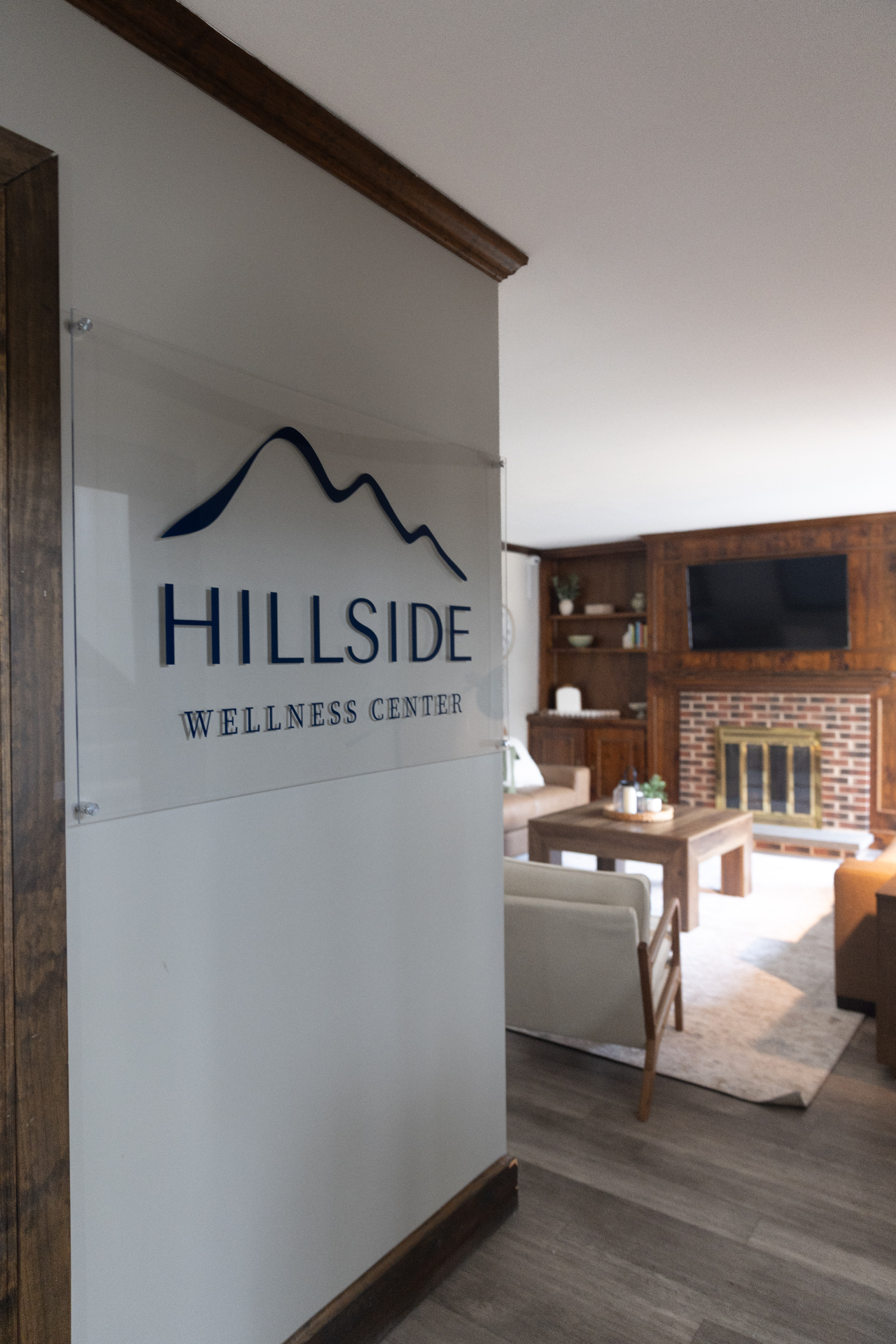Hillside Wellness Center glass lobby sign