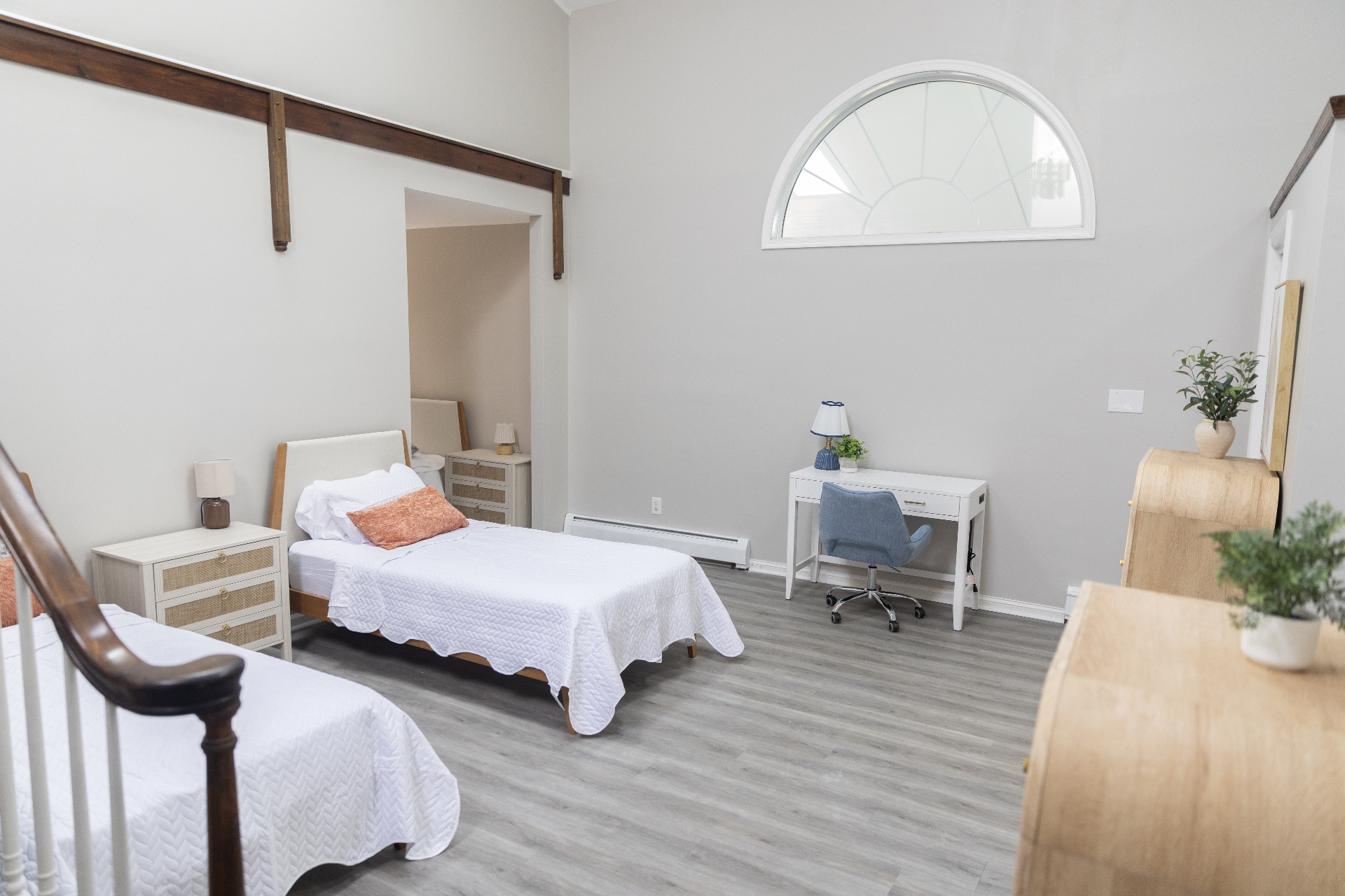 Bedroom with two twin beds and neutral decor